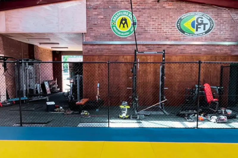 Affordable chain wire fencing setup for indoor gym and sports facility separation — Muller's Fencing Sydney